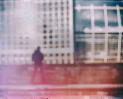 film photography of aman and buildings